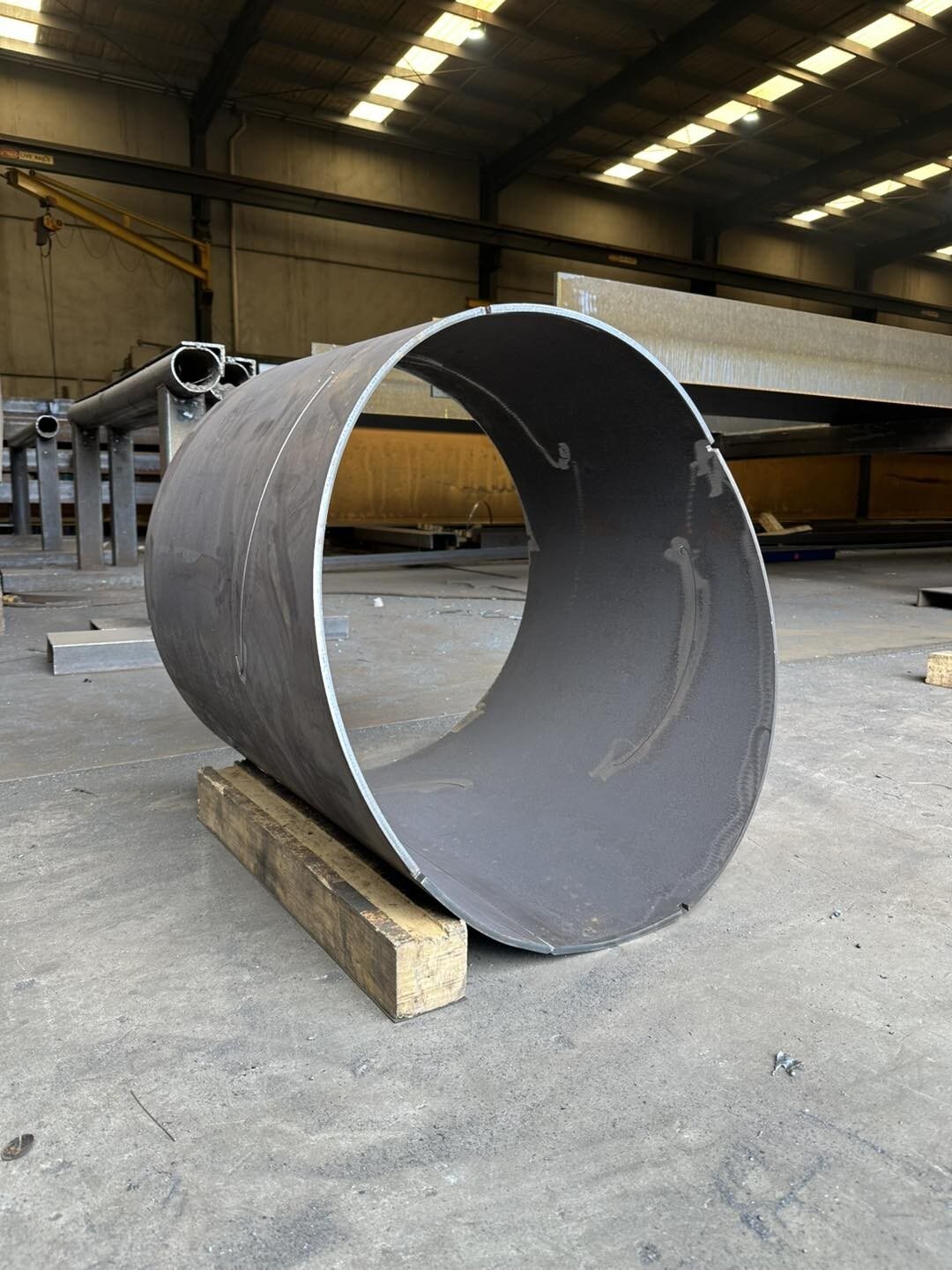 Rolled steel cylindrical section on pallet