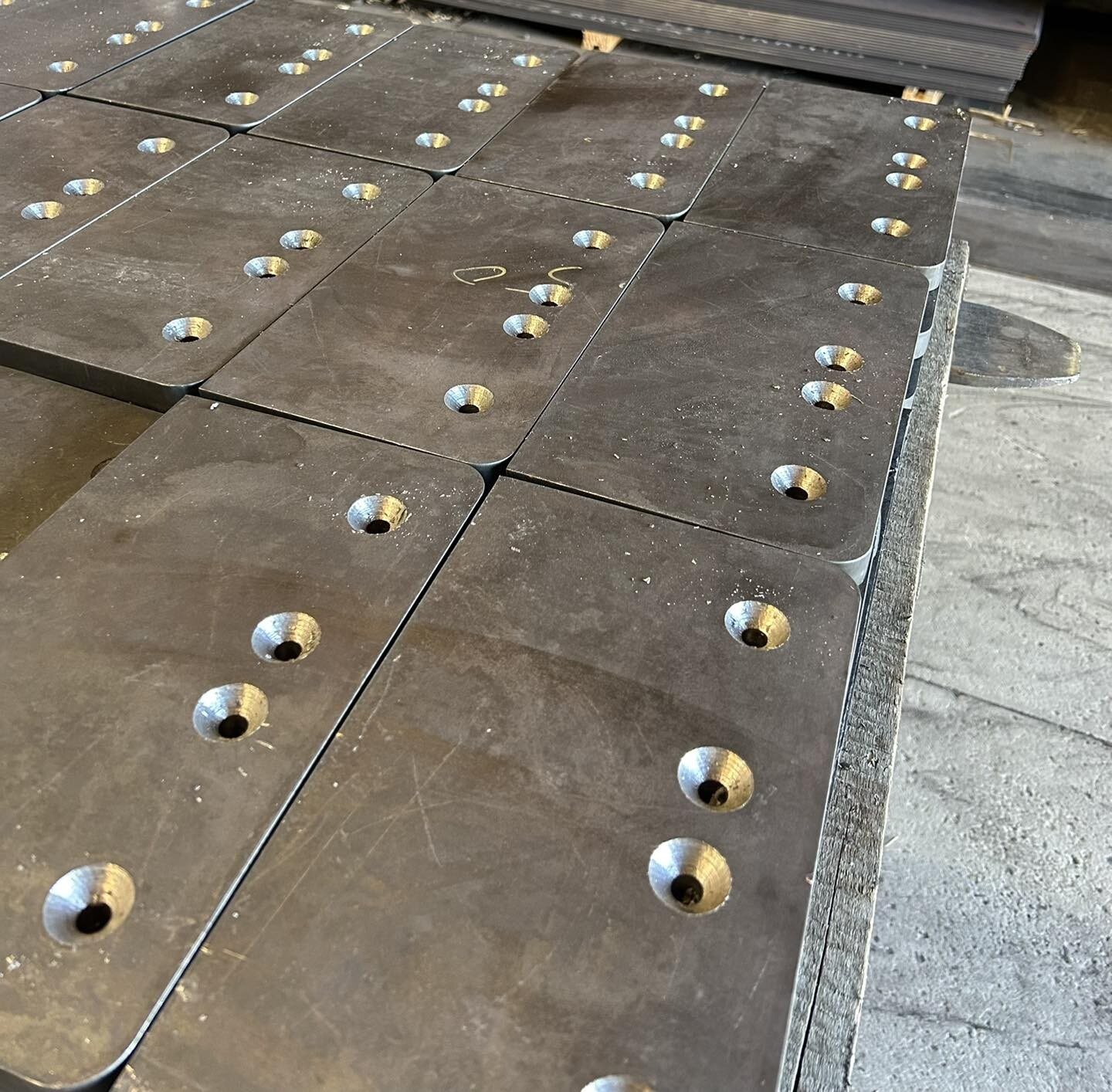 Steel plates with countersunk and drilled holes